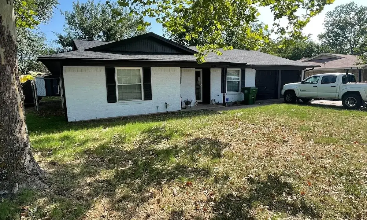 Professional roofing crew working on a residential roof in West Vero Corridor